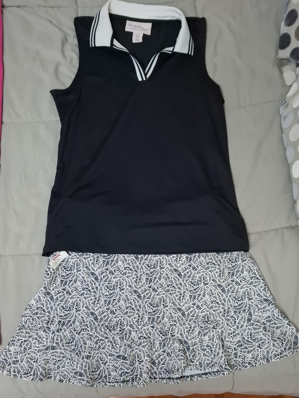 Sleeveless Black Polo Skirt Set with White Patterned Skirt